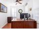 Bright home office with a large desk, natural light, and hardwood floors at 120 Fresh Meadow Ln, Mount Pleasant, SC 29466