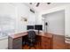 Bright home office with a wood L-shaped desk, hardwood floors, and natural light from a window with blinds at 120 Fresh Meadow Ln, Mount Pleasant, SC 29466