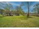 View of the home's backyard, highlighting the expansive lawn and beautiful landscaping at 123 Tiffany Ln, Summerville, SC 29485