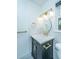 Stylish bathroom vanity featuring gold fixtures, custom mirror and modern lighting at 123 Tiffany Ln, Summerville, SC 29485