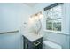 Updated bathroom vanity featuring gold fixtures, modern lighting and a custom mirror at 123 Tiffany Ln, Summerville, SC 29485
