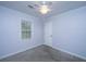 This bedroom has soft purple walls, neutral carpet, a ceiling fan, and a bright window at 123 Tiffany Ln, Summerville, SC 29485