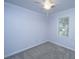 This bedroom has soft purple walls, neutral carpet, a ceiling fan, and a bright window at 123 Tiffany Ln, Summerville, SC 29485