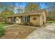 Single story home with brick facade, black shutters, well kept landscaping, and attached drive at 123 Tiffany Ln, Summerville, SC 29485