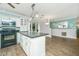 Spacious kitchen featuring an island, white cabinetry and stainless steel appliances at 123 Tiffany Ln, Summerville, SC 29485