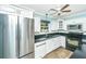 A kitchen featuring stainless steel appliances, white cabinetry and black countertops at 123 Tiffany Ln, Summerville, SC 29485