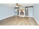 Living room featuring wood floors, a decorative fireplace with white mantle, and natural light at 123 Tiffany Ln, Summerville, SC 29485