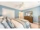 Light bedroom featuring a ceiling fan, and a bed with a comfortable comforter and decorative pillows at 1310 Belhaven Dr, Mount Pleasant, SC 29466