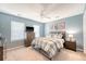 Cozy bedroom with a ceiling fan, a dresser with a TV, and a comfortable bed with plaid bedding at 1310 Belhaven Dr, Mount Pleasant, SC 29466