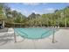 Community pool with surrounding lounge chairs, umbrellas, and covered seating area at 1310 Belhaven Dr, Mount Pleasant, SC 29466