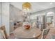 Charming dining area with a stylish light fixture, stainless steel appliances, and views of the open living space at 1310 Belhaven Dr, Mount Pleasant, SC 29466