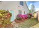 Charming home exterior with a light blue door and colorful azalea bushes in the front yard at 1310 Belhaven Dr, Mount Pleasant, SC 29466