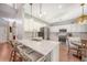Bright and open kitchen featuring stainless steel appliances, ample counter space, and a breakfast bar with seating at 1310 Belhaven Dr, Mount Pleasant, SC 29466