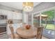 Bright kitchen with a breakfast nook, stainless steel appliances, and view of outdoor patio and backyard at 1310 Belhaven Dr, Mount Pleasant, SC 29466