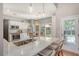 Modern kitchen with stainless steel appliances, white cabinets, granite countertops, and a stylish island with seating at 1310 Belhaven Dr, Mount Pleasant, SC 29466