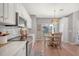 Bright eat-in kitchen featuring stainless appliances, white cabinets, and sliding glass door to the backyard at 1310 Belhaven Dr, Mount Pleasant, SC 29466