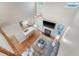 Spacious living room with fireplace, plush sofa, and a view of the kitchen at 1310 Belhaven Dr, Mount Pleasant, SC 29466