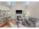 Bright living room featuring a fireplace, hardwood floors, and an open layout perfect for entertaining and relaxation at 1310 Belhaven Dr, Mount Pleasant, SC 29466