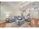 Bright living room with hardwood floors, a large sofa and lots of natural light at 1310 Belhaven Dr, Mount Pleasant, SC 29466