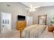Bright main bedroom with vaulted ceilings, dresser, and ensuite bathroom at 1310 Belhaven Dr, Mount Pleasant, SC 29466