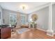 Charming office with hardwood floors, shutters, and decorative wall art at 1310 Belhaven Dr, Mount Pleasant, SC 29466