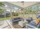 Cozy sunroom filled with natural light, comfortable seating, and views of the lush backyard, creating a peaceful retreat at 1310 Belhaven Dr, Mount Pleasant, SC 29466