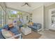 Bright and airy sunroom with comfortable seating and large windows, offering a serene space to relax and enjoy the outdoors at 1310 Belhaven Dr, Mount Pleasant, SC 29466