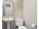 Bright and modern half bathroom featuring a pedestal sink and white fixtures at 1314 Garland St, North Charleston, SC 29420