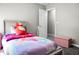 Bright bedroom featuring soft gray walls and a cozy bed with a colorful unicorn theme at 1314 Garland St, North Charleston, SC 29420