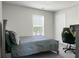 Bedroom with lots of natural light with neutral colored walls and a gray bedset at 1314 Garland St, North Charleston, SC 29420