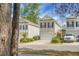 Charming townhouse with neutral siding, black shutters, a one car garage and well-maintained landscaping at 1314 Garland St, North Charleston, SC 29420