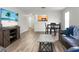 Open-concept living area with hardwood floors, flowing seamlessly into dining and kitchen, perfect for Gathering gatherings at 1314 Garland St, North Charleston, SC 29420