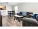 Open concept living room with hardwood floors and lots of natural light perfect for entertaining at 1314 Garland St, North Charleston, SC 29420