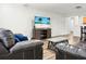 Spacious living room with a modern TV, hardwood floors, and comfortable seating for relaxation at 1314 Garland St, North Charleston, SC 29420