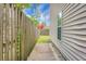 A side yard is visible with a wooden fence and access to the backyard at 1314 Garland St, North Charleston, SC 29420
