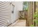 This home has a side yard with a wooden fence and a door at 1314 Garland St, North Charleston, SC 29420