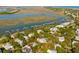 Aerial view of the property highlighting its proximity to the water, marina, and surrounding neighborhood at 1316 Thompson, Sullivans Island, SC 29482