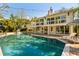Backyard features a private pool, patio and a two story home with a deck at 1316 Thompson, Sullivans Island, SC 29482