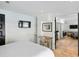 View of the comfortable bedroom with seating, tv, and access to other living areas at 1316 Thompson, Sullivans Island, SC 29482