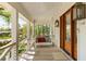 Cozy front porch with a swing and wooden floors, creating a relaxing outdoor space at 1316 Thompson, Sullivans Island, SC 29482