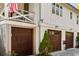 Attached garages with dark wood doors, providing convenient access and curb appeal to the home at 1316 Thompson, Sullivans Island, SC 29482