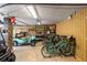 Organized garage with golf cart, bicycles, storage racks, and ample space for outdoor equipment at 1316 Thompson, Sullivans Island, SC 29482