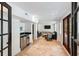 Bright living room with tiled floors, bar area, recessed lights, and shiplap walls at 1316 Thompson, Sullivans Island, SC 29482