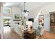 Bright living room featuring a brick fireplace, high ceilings, and comfortable seating arrangement at 1316 Thompson, Sullivans Island, SC 29482