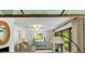 Open concept living area with bright natural light and view into the lanai at 1316 Thompson, Sullivans Island, SC 29482