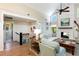 Beautiful open-concept living space with fireplace, staircase, and comfortable seating at 1316 Thompson, Sullivans Island, SC 29482