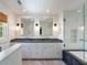 Spa-like bath boasts dual vanity and glass shower/tub combo at 1316 Thompson, Sullivans Island, SC 29482