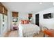 Comfortable main bedroom with tile floors, wood blinds and a pink nightstand at 1316 Thompson, Sullivans Island, SC 29482