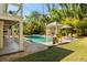 Relaxing backyard pool with a covered gazebo, outdoor grill, and mature trees for shade and privacy at 1316 Thompson, Sullivans Island, SC 29482
