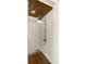 Modern outdoor shower featuring white wooden walls, wooden floor, and brushed chrome hardware at 1316 Thompson, Sullivans Island, SC 29482